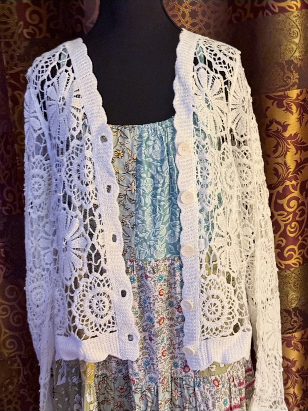 Crochet cardigan paired over a Country Patchwork Sundress